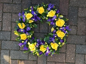 Purple, blue, yellow, wreath, funeral flowers, funeral tribute, gravesend