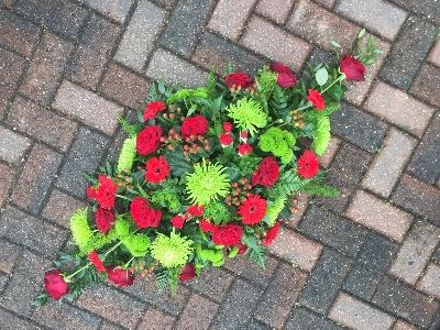 Red, green, fresh, modern, vibrant, coffin, spray, funeral, flowers, tribute, Gravesend, Kent, florist