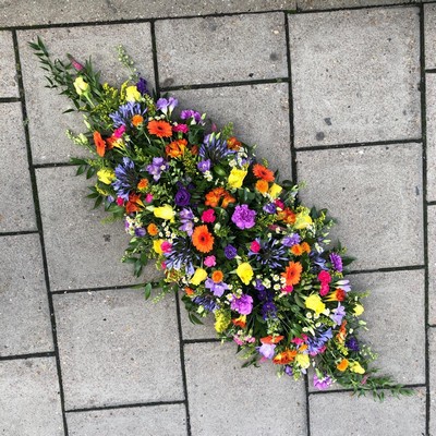 Vibrant, bright, roses, gerberas, rainbow, coffin, casket, oasis, spray, Funeral, sympathy, wreath, tribute, flowers, florist, gravesend, Northfleet, Kent, london