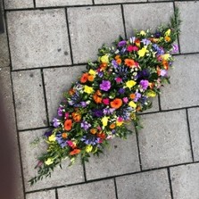 Vibrant, bright, roses, gerberas, rainbow, coffin, casket, oasis, spray, Funeral, sympathy, wreath, tribute, flowers, florist, gravesend, Northfleet, Kent, london