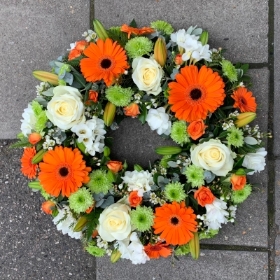 Orange, green, white, Funeral, sympathy, wreath, tribute, flowers, florist, gravesend, Northfleet, Kent, London, Essex 