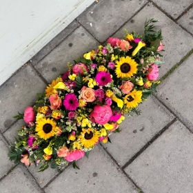 Bright, pretty, yellow, orange, cerise, coral, coffin, spray, top, Funeral, sympathy, wreath, tribute, flowers, florist, gravesend, Northfleet, Kent, London, Essex 