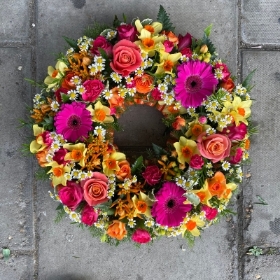 Tutti fruiti, ring, yellow, orange, coral, cerise, Funeral, sympathy, wreath, tribute, flowers, florist, gravesend, Northfleet, Kent, London, Essex 